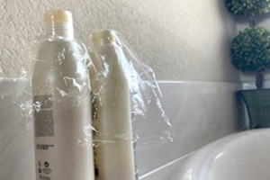 soap bottles covered with plastic wrap 