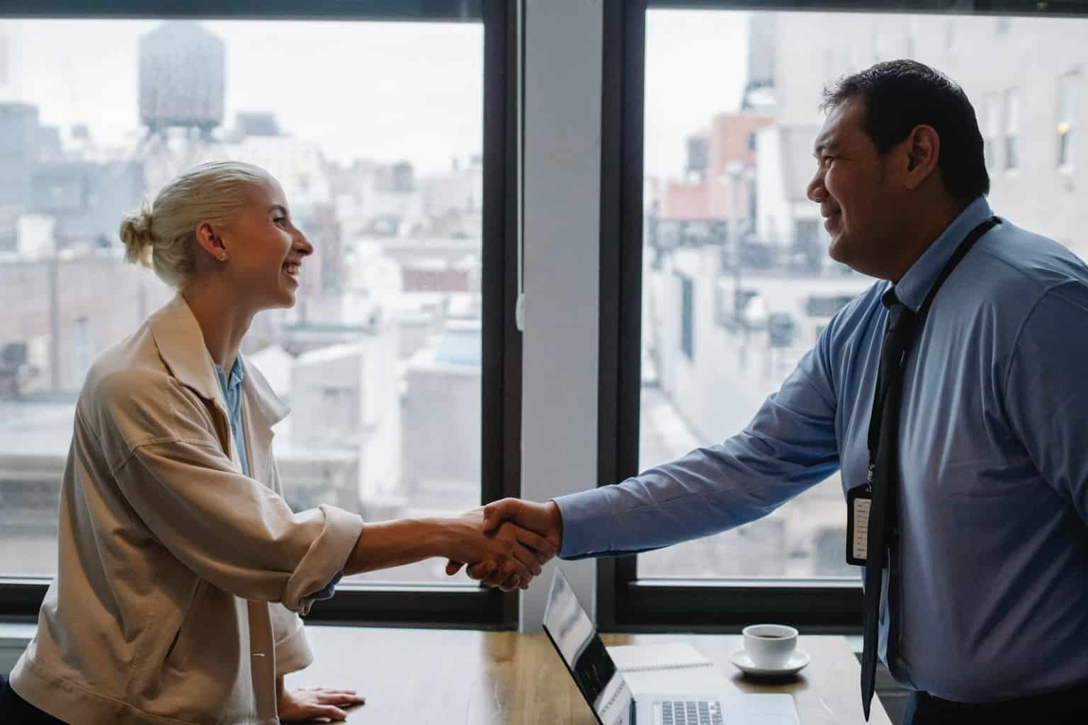 employee shaking hands with recruiter